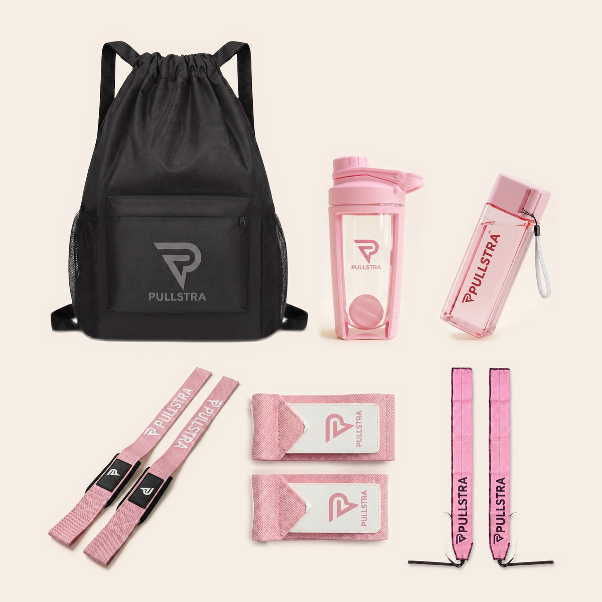 Coffret musculation rose Pullstra 6 pièces : sac de sport 30 L, shaker rose, bouteille rose, sangles de tirage roses et deux paires de bandes de poignet roses